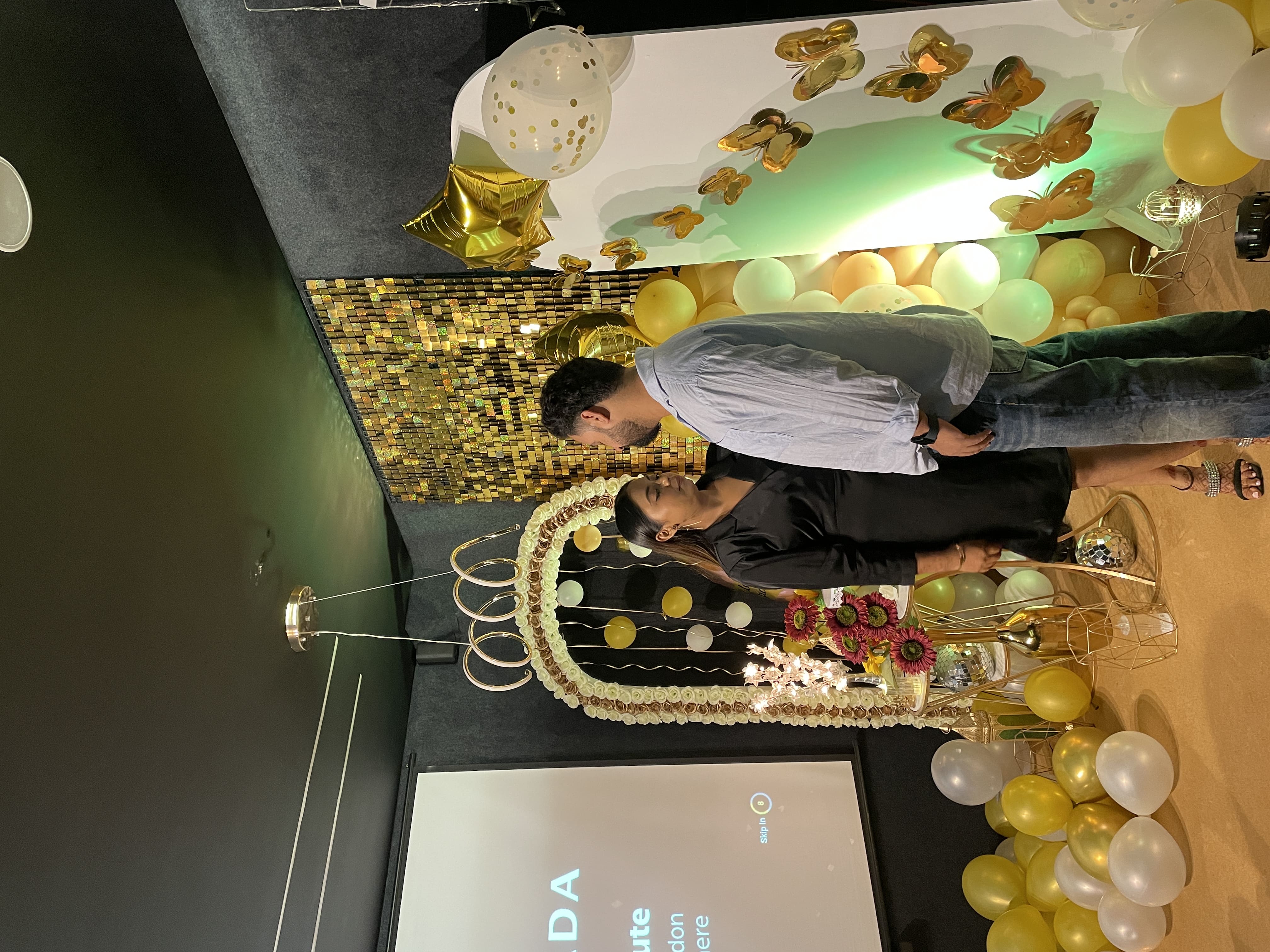 A person with long hair standing in front of a mirror